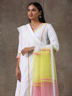 A three piece soft cotton kurta set in white comes with an attached mulmul lining. It has colour block laces with organza insert on the neck,sleeves and pants. It is paired with a white soft cotton straight pant with an attached mulmul lining with organza insert and colour block laces. Color: White Fabric Composition: Kurta Set - Soft cotton Dupatta - Organza Note: The product will be delivered within 20-25 days of order placed Care Instruction: Dry Clean Only. Do not use heavy Iron Designer Cotton Palazzo Set With Sheer Dupatta, Cotton Sets With Sheer Dupatta For Festivals, Traditional Cotton Kurta With Sheer Dupatta, White Straight Kurta With Sheer Dupatta, White Cotton Silk Sets For Diwali, White Churidar For Spring Festive Occasions, White Churidar For Festive Spring Occasions, White Churidar For Festive Spring Season, White Mulmul Sets For Diwali