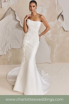 Fitted satin wedding dress with 3D floral details throughout the gown. Kleinfeld Bridal, Summer 2025, Bridal Elegance, Fit And Flare Wedding Dress