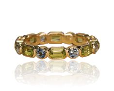 DESCRIPTION *Band Width : 4.08 mm *Emerald Cut Natural Color Stone Eternity Band *Channel Set , Thick Gold Band *Metal Options: 14k White Gold/ 14k Yellow Gold/ 14k Rose Gold *Accent Stone 1: Peridot *Size of stone: 5x3mm/Emerald Cut *Carat Weight: 2.45ct *Color: Vibrant Yellowish Green *Clarity: Type II - Very Slightly Included/VSI *Cut: Precision Cut *Accent Stone 2: Aquamarine *Size of stone: 3.2mm *Carat Weight: 0.84ct *Color: Soothing Light Blue *Clarity: Type I - Eye Clean *Cut: Precision Green Gemstone Eternity Band Fine Jewelry, Green Multi-stone Baguette-cut Jewelry, Green Multi-stone Baguette Cut Jewelry, Green Baguette Cut Multi-stone Jewelry, Thick Gold Band, Yellowish Green, Band Metal, Rose Gold Accents, Pink Tourmaline Ring