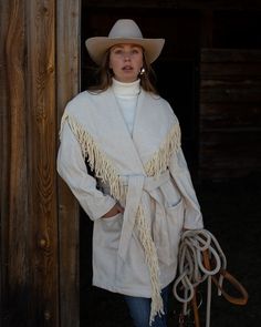 Fall Outerwear With Tassels, Chic Fall Outerwear With Tassels, Chic Winter Fringe Outerwear, Chic Beige Outerwear With Fringe, Chic Beige Fringe Outerwear, Winter Long Sleeve Outerwear With Tassels, Fringe Long Sleeve Outerwear For Winter, Winter Outerwear With Tassels And Long Sleeves, Beige Fringed Winter Outerwear