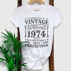 If you're looking for a unique and stylish way to wear on your 50th Birthday, then check out our vintage 1974 shirt! This shirt features a soft, comfortable fabric and a cool, retro design. Whether you're dressing up for a special occasion or just want to feel nostalgic, this shirt is perfect for you. Our vintage 1974 shirt is also great for birthdays, anniversaries, or any other special day. So don't wait any longer - order your vintage 1974 shirt today! 1970S, Vintage 1974 Shirt, Vintage 1974 Shirt, Vintage T Shirt 70S, 1974 birthday TShirt, Retro Birthday Tee, 1974 Birthday Shirt, 50th Birthday Gift, 50Th Birthday Shirt, Vintage Birthday Tee, 1974 Gift Tee, Classic 1974 Shirt, Vintage T Shirt  #Vintage1974 #1974Birthday #RetroStyle #VintageTShirt #50thBirthday #1974Shirt #ClassicDesign Vintage Birthday T-shirt With Text Print, Classic Graphic Print T-shirt For Birthday, Vintage Cotton T-shirt As Gift, Retro Graphic Print Top For Gift, Retro Graphic Print Top, Retro Graphic Print Top As Gift, Vintage Short Sleeve Tops For Gift, Vintage White T-shirt For Birthday, Vintage Screen Print Tops For Gift