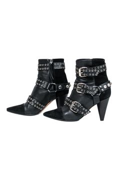 Unleash your inner rocker chick in these over-the-top booties from Isabel Marant. Buckles with grommets and studs adorn these edgy boots. Perfect for your next concert! Pair with distressed jeans and a leather jacket and you'll be sure to be invited on stage! Size 5.5 (FR 37) Leather upper w/ suede trim Buckled design w/ grommets and studs Interior side zipper closure Pointed toe Chunky heel Leather sole and footbed w/ very minor wear Heel 3.5" Edgy Winter Boots With Grommets, Edgy Studded Ankle-high Boots, Punk Boots With Studded Rubber Outsoles And Pointed Toe, Edgy Black Heeled Boots With Rivets, Punk Black Studded Heeled Boots, Punk Black Heeled Boots With Studs, Edgy Moto Boots With Grommets For Fall, Edgy Ankle-high Boots With Rivets, Edgy High-heeled Boots With Studs