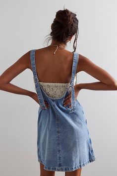 You asked, we delivered — our top-rated High Roller jumpsuit, now in a pinafore-inspired skirtall. **Fit:** Shapeless silhouette with authentic rigid denim **Features:** Scoop neckline, adjustable buckle straps, seamed paneling, dropped pouch pockets **Why We ❤ It:** Perfectly layered with a cozy sweater or toughened-up with a graphic tee, this skirtall is a true staple in your denim collection. | We The Free High Roller Skirtall at Free People in Medium Wash, Size: XL Country Concert Outfits, High Roller, Denim Overall Dress, Follow Your Heart, Denim Collection, Cozy Sweater, Overall Dress, Cozy Sweaters, S Models