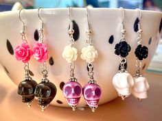 Dainty ceramic skulls with rose accent beads. Silver-plated hardware and hypoallergenic 925 hooks Hardware Jewelry Diy, Skull Bead Jewelry, Halloween Jewelry Diy, Haunt Couture, Halloween Beaded Jewelry, Beaded People, Sugar Skull Jewelry, Safety Pin Jewelry, Diy Earrings Easy