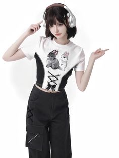 This adorable top features a whimsical rabbit print that adds a cute and kawaii vibe to any outfit. The cropped design gives it a trendy and modern look, perfect for pairing with high-waisted jeans or skirts. Made from soft and comfortable fabric, this t-shirt is a must-have for anyone who loves combining lolita and kawaii fashion elements in their style.   	 		 			Size 			S 			M 			L 		 		 			Shoulders 			36.5 			37.5 			38.5 		 		 			Bust 			78 			82 			86 		 		 			Sleeve Length 			17.5 			18.5 			19.5 		 		 			Full Length 			41 			43 			45 Fitted Harajuku Style Tops For Spring, Cropped Streetwear Tops For Spring, Cropped Tops For Spring Streetwear, Fitted Harajuku Cotton Tops, Fitted Cotton Harajuku Tops, Spring Harajuku Style Fitted T-shirt, Fitted Harajuku T-shirt For Spring, Spring Harajuku Fitted T-shirt, Kawaii Fitted Tops For Spring