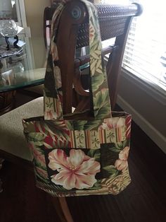 Pretty Tropical Print Handbag. Soft colors of Beige, soft pinks & green. Inside pocket. Straps can go over shoulder, but not to long to carry. Approximately  13"H x 14" W Large Green Casual Bag, Large Casual Shoulder Bag With Removable Pouch, Casual Large Shoulder Bag With Removable Pouch, Green Hobo Satchel Bag With Pockets, Large Green Casual Shoulder Bag, Casual Green Rectangular Hobo Bag, Green Satchel Hobo Bag With Pockets, Casual Large Green Shoulder Bag, Large Green Shoulder Bag For Everyday Use