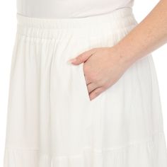 Elevate your fashion game with this flowy and effortlessly chic skirt. This maxi skirt from White Mark boasts a pleated design that adds texture, movement, and a touch of sophistication to your look. Dress it up or down as this skirt is incredibly versatile. Pair it with a tucked in blouse and heels for a sophisticated look or go for a more relaxed vibe with a tucked in tee and sandals and pair it with a jacket on chilly days. It’s perfect for various occasions and style preferences. Solid Color Tiered Skirt With Pleated Waist, White Maxi-length Bottoms For Day Out, White Maxi Skirt With Elastic Waistband For Spring, White Maxi Length Bottoms For Day Out, White Maxi Bottoms For Day Out, White Pleated Wide Leg Maxi Skirt, White Maxi Length Bottoms For Spring, White Voluminous Tiered Maxi Skirt, Casual Tiered Maxi Skirt With Pleated Waist