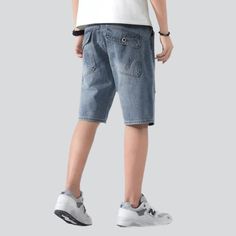 Make a statement with our 2023 Summer Collection Damaged Men's Jean Shorts! Featuring a street-inspired style, mid-waist fit, and zipper & button closure, these shorts will have you looking and feeling your best. Enjoy unparalleled comfort and effortless style with these ageless classics.Distinctive Features Street Style: Look your best with a street-inspired vibe that's perfect for any summer occasion. Ripped: Make a daring statement with these ripped jean shorts, showcasing your fashion-forwar Spring Streetwear Jean Shorts, Denim Blue Streetwear Shorts, Urban Style Short Jeans For Summer, Urban Style Summer Short Jeans, Blue Jean Shorts For Streetwear, Urban Style Denim Blue Shorts For Streetwear, Urban Denim Blue Shorts For Streetwear, Urban Jean Shorts For Spring, Denim Blue Knee-length Jean Shorts For Streetwear