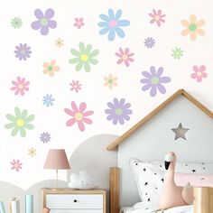 a child's bedroom with flowers painted on the wall