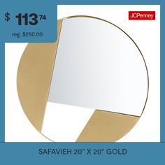 a round mirror sitting on top of a blue and white tablecloth next to a gold frame