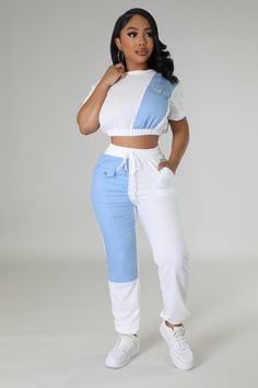 Two piece set Crop top Round neckline Short sleeves Denim detail Elastic waistband No closure High waisted pants Elastic waistband Pockets Denim detail Cuffed bottom No closure 100% cotton Wash warm Inseam is 32 inches Model is wearing a small MODEL STATS Height: 5.3"Bust:33" / Waist:28" / Hips:42" Please see size chart for information on the fit Casual White High Waist Sets, Blue High Waist Cotton Top, Blue Cropped Cotton Pants, Fitted Blue Denim Sets, High Waist Denim Blue Cotton Crop Top, Casual Cotton Crop Top With Pockets, Fitted Cotton Crop Top With Pockets, Cropped Blue Denim Pants, Casual High-waist Denim Blue Crop Top