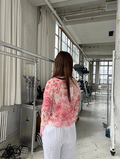 This long-sleeved blouse features a floral print and a v-neckline, offering a stylish and comfortable fit. Perfect for various occasions, it combines grace with ease. The blouse's loose and flowing design ensures comfort throughout the day, making it a versatile piece for both casual and formal settings. The delicate floral pattern adds a touch of charm, while the lightweight material keeps you feeling fresh and at ease. Features: Material: 100% Polyester. Design: Long sleeves with a v-neckline Floral Print Long Sleeve Blouse For Day Out, Long Sleeve Floral Print Blouse For Day Out, Printed Long Sleeve Tops For Daywear, Feminine Flowy Long Sleeve Tops, White V-neck Long Sleeve Top For Spring, Flowy Long Sleeve Printed Blouse, Pink Flowy Long Sleeve Blouse, Printed Long Sleeve Top For Spring, Feminine Long Sleeve Floral Print Top