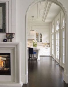 an image of a living room with fireplace and dining area in the backround