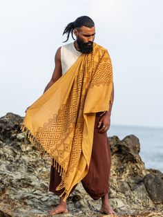 Adiyogi Shawl, perfect for summer wear. This lightweight shawl boasts a beautiful bohemian design with a touch of comfort. The unique block print makes it ten times more attractive, and the color is just perfect for any occasion. Stay stylish with the Adiyogi Shawl.  Stand out and make a statement with this unique and stylish accessory. Add a touch of flair to any outfit and let your personality shine. Express yourself with the Adiyogi Shawl and create your own fashion statement. Bohemian Cotton Handloom Shawl, Bohemian Pashmina Shawl Wrap, Bohemian Cotton Shawl For Festivals, Bohemian Cotton Handloom Scarves, Bohemian Yellow Scarves For Beach, Bohemian Cotton Shawl With Woven Motifs, Folk Style Cotton Shawl For Festivals, Bohemian Pashmina Shawl For Festivals, Cotton Beach Shawl