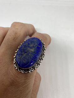 Large genuine blue Lapis Lazuli Vintage ring Flower hand carved Low content silver not sterling. Size 9 Can be re sized. My jeweler charges $10-$20 All rings are shipped in a nice gift box. Check out our over a THOUSAND great reviews Engraving is $4 per letter and is not always perfect depending on the piece. It can take a few days if the jeweler is busy. This is payable to Paypal Judithsltd@gmail.com Blue Gemstone Flower Ring Gift, Gift Blue Gemstone Flower Ring, Artisan Blue Engraved Jewelry, Artisan Engraved Blue Jewelry, Blue Flower Ring For Gift, Unique Blue Flower Ring For Gift, Unique Blue Engraved Jewelry, Silver Carved Oval Jewelry, Vintage Lapis Lazuli Jewelry As Gift