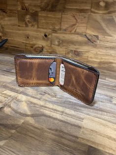 This is a Basic Bifold. Its not too big and not to small. It can be toted in the back pocket or it fits nicely in the front pocket. It has one pocket for bills and 2 good size card pockets. It measures 4 inches x 3.375. The perfect size Minimalist Wallet for those who carry in the front pocket. Leather. Being a natural material, the shade of leather will vary with every wallet made. Brown Trifold Wallet With Coin Pocket For Everyday, Bifold Wallet With Flat Pocket For Daily Use, Casual Bifold Wallet With Coin Pocket, Casual Bifold Wallets With Coin Pocket, Casual Bifold Wallet For Everyday Use, Casual Everyday Wallets With Pockets, Brown Trifold Wallet With Pockets, Casual Bifold Wallet With Card Slots, Casual Brown Bifold Card Holder