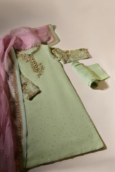 Turn heads in " Azaa " like its name, Azaa is a vision to behold, rendered on pistachio green pure organza with delicate handwork details, paired with heavy teapink pure dupatta organza dupatta and matching raw silk trousers. The length of the kameez is 45 inches. Delivery Time: 4 to 8 Weeks Luxury Pista Green Salwar Kameez With Dabka, Cheap Traditional Dupatta With Zari Work, Luxury Pista Green Traditional Wear With Dabka Work, Affordable Art Silk Dupatta For Eid, Luxury Organza Churidar With Dabka Work, Luxury Raw Silk Dress With Dabka Work, Cheap Zari Work Dupatta For Eid, Luxury Handwork Unstitched Chanderi Suit, Cheap Chanderi Dupatta For Diwali