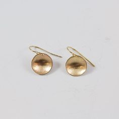 Match these with just about any outfit in your closet. One of our best sellers and one of the new jewelry staples of your wardrobe.  http://www.clpjewelry.com/new/concave-small-earrings  .  .  .  #clpjewelry #handmadejewelry #gold #earrings #goldearrings #jewelry #denverjewelry #303style #dangles #shop303 #shopdenver Yellow Gold Circle Brass Earrings, Yellow Gold Circle Earrings In Brass, Everyday Brass Circle Earrings, Everyday Brass Circular Earrings, Everyday Circular Brass Earrings, Adjustable Hammered Minimalist Earrings, Minimalist Hammered Adjustable Earrings, Hammered Minimalist Adjustable Earrings, Everyday Round Wrap Earrings For Pierced Ears