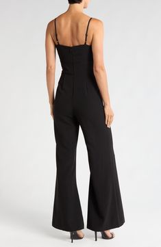 A fresh alternative to the usual party frock, this flare-leg jumpsuit exudes elegant charm with a lavish bow at the bust and a curve-skimming fit. 31" inseam; 28" leg opening; 53" center front length (size 8) Back zip closure Sweetheart neck Adjustable straps Partially lined 95% polyester, 5% spandex Machine wash, tumble dry Imported Evening Wide-leg Fitted Jumpsuit, Fitted Strapless Wide-leg Jumpsuit For Evening, Chic Fitted Flare Jumpsuits And Rompers, Solid Color Strapless Wide Leg Jumpsuit For Party, Glamorous Fitted Wide Leg Jumpsuits And Rompers, Glamorous Full Length Jumpsuits And Rompers For Formal Occasions, Glamorous Full Length Jumpsuits And Rompers For Formal Events, Glamorous Full-length Formal Jumpsuits And Rompers, Strapless Wide Leg Jumpsuit For Date Night