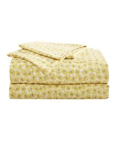 a yellow and white floral print sheet set