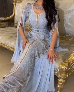 Elevate your style with our Dreamy Vow Luxury Dubai Moroccan Kaftan. Featuring a stunning blue evening dress with elegant long sleeves, this dress is perfect for any formal occasion. Made with high-quality materials, it's perfect for a wedding party or any special event. Stay elegant and stylish with this Muslim Arabic formal dress. Blue Floor-length Gown For Eid, Formal Floor-length Evening Dress For Eid, Royal Blue Long Sleeve Dress For Banquet, Elegant Light Blue Evening Dress For Banquet, Royal Blue Long Sleeve Gown For Banquet, Traditional Long Sleeve Evening Gown, Eid Elegant Maxi Evening Dress, Traditional Long Sleeve Fitted Evening Dress, Elegant Maxi Length Evening Dress For Eid