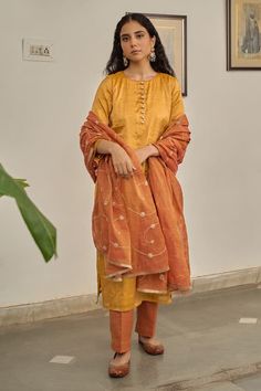 Warm yellow plain kurta. Paired with a pant. Comes along with a rust dupatta with hand embroidery and kiran lace border. - Aza Fashions Traditional Festive Pant Set With Sheer Dupatta, Festive Traditional Pant Set With Sheer Dupatta, Festive Tussar Silk Palazzo Set With Straight Kurta, Tussar Silk Palazzo Set With Sheer Dupatta, Traditional Semi-stitched Pant Set With Sheer Dupatta, Tussar Silk Sets With Sheer Dupatta For Eid, Traditional Pant Set With Sheer Dupatta For Eid, Traditional Pant Set With Sheer Dupatta For Designer Wear, Traditional Pant Set With Sheer Dupatta For Diwali