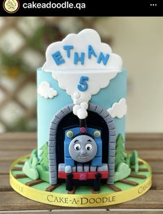 a thomas the train birthday cake on a table