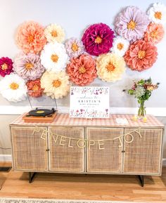 a table topped with flowers and a sign