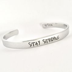 STAY STRONG This inspirational hand stamped cuff bracelet makes the perfect gift to give or treat for yourself. The cuff is 1/4 inch by 6 inches and is bent to fit most wrists. My items are hand stamped by me, making them a unique gift. Each letter is stamped individually and may not line up exactly adding to the charm and uniqueness of the gift. Visit my shop to view all of my other items by clicking here: https://www.etsy.com/shop/GemsbyJohnna Please see my shop header for current production t Personalized Inspirational Cuff Bracelet For Everyday, Everyday Inspirational Personalized Cuff Bracelet, Adjustable Personalized Cuff Bracelet For Everyday, Inspirational Stamped Adjustable Cuff Bracelet, Inspirational Adjustable Cuff Bracelet For Personalized Gift, Personalized Everyday Meaningful Cuff Bracelet, Everyday Personalized Meaningful Cuff Bracelet, Inspirational Adjustable Stamped Cuff Bracelet, Adjustable Stamped Meaningful Cuff Bracelet