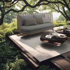 an outdoor living room with couches and tables