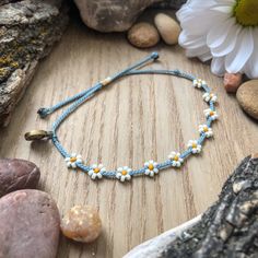 "Choose simplicity with these little white daises on light blue cord!  This bracelet matches perfectly with \"Spring Daisy\" found here: https://colorsoftheprairie.etsy.com/listing/1690353478 And it would also look great with \"Spring Mix\" found here: https://colorsoftheprairie.etsy.com/listing/1689885210  Please keep in mind that even though I try my best to keep the spacing even between flowers, I'm not a machine and the spaces are not all perfectly equal. I think this adds to unique-ness and Adjustable Daisy Bracelets For Spring, Adjustable Friendship Bracelets For Everyday Spring Wear, Adjustable Friendship Bracelets For Everyday In Spring, Adjustable Daisy Everyday Jewelry, Adjustable Daisy Beaded Bracelets Gift, White Friendship Bracelets For Everyday Spring, White Flower Friendship Bracelets Casual Style, White Flower-shaped Friendship Bracelets, Casual White Flower Friendship Bracelets