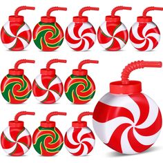 a set of red, green and white candy jars with swirly designs on them