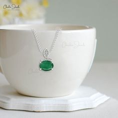 Description Elevate the elegance with our 14k gold dainty emerald & diamond accented pendant. Crafted in 14k gold, this pendant is dressed with 8x6mm oval-cut emerald gemstone and accentuated with sparkling diamonds. Shop Now!!! The gold chain shown in pictures is just for reference and display purpose, in order pendant comes with a COMPLIMENTARY 925 SILVER CHAIN. Product Details SKU CJ-P-1405-EM Metal 14K solid gold Style DAINTY PENDANT Certification - Emerald Details Size 8x6mm Quality AA Piec Classic Emerald Pendant Necklace With Diamond Accents, Hallmarked Emerald Necklace, Classic Cubic Zirconia Emerald Necklace, Emerald Pendant Necklace With Diamond Accents For May Birthstone, Elegant Emerald Birthstone Necklace For Anniversary, Elegant Emerald Pendant Necklace With Diamond Accents, Elegant Emerald Pendant Necklace With Gemstone Accents, Elegant Round Pendant Emerald Necklace, Elegant Emerald Pendant Necklace For May Birthstone