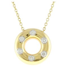 TIFFANY & Co. Etoile 18K Gold Diamond Circle Pendant Necklace Metal: 18K Gold Weight: 4.90 grams Chain: 16" long Pendant: 13mm in diameter Diamond: 6 round brilliant diamonds, carat total weight .18 Hallmark: "TIFFANY&CO. 750 PT950" on pendant, "TIFFANY&CO. 750" on chain clasp Condition: Excellent condition, like new Limited edition, no longer available for sale in Tiffany stores Authenticity Guaranteed Diamond Circle Pendant, Tiffany Diamond, Diamond Heart Pendant Necklace, Circle Pendant Necklace, Circle Diamond, Heart Pendant Diamond, Modern Necklaces, Ball Pendant, Long Pendant