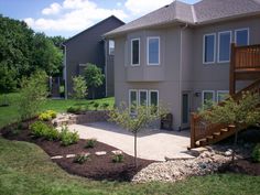 a large house with landscaping in the front yard