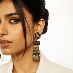 The Aria Cleopatra earrings feature a statement drop earring pattern with jade-colored stones and a dark oxidized finish with gold detailing with patterns that are inspired by the architecture of Egyptian Queens. Gifting: This choker set comes in a beautiful Yamoona gift box, making it an ideal gift for birthday, wedding anniversary or wedding gift. Occasion: Perfect choice for any Indian occasion, festivals, parties, dances, and weddings Care: We recommend you protect your silver jewellery and increase the longetivity of the plating by placing the jewelry in a fabric pouch and storing it in a cool, dry place, keeping individual pieces separate to avoid scratching. Also to maintain the best condition of your jewellery remove when showering, swimming or when undertaking manual or domestic w Contemporary Silver Jewelry, Silver Jewelry Wedding, Egyptian Queen, Silver Wedding Jewelry, Colored Stones, Statement Drop Earrings, Gold Party, Oxidised Jewellery, Saree Look