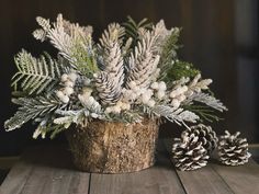 #christmasflowers #snowy #christmasdecorideas #winter #greenery Evergreen Centerpiece, Snowy Pinecone, Zinc Planters, Winter Floral Arrangements, Christmas Flower Arrangements, Christmas Floral Arrangements, Faux Floral Arrangement, Rustic Centerpieces, Birch Bark