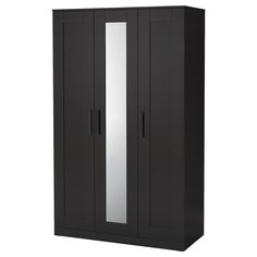 a black armoire with mirrored doors and drawers