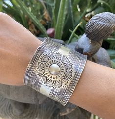 "❋ Handmade Sterling Silver Wide Boho Statement Cuff with Engraved Oxidized Silver Solar Mandala ❋ Dimensions: Width: About 1.5\" (3.8 cm), Length: About 6.9\" / 17.5cm ❋ Metal Purity: 95% Pure Silver (Purer than 925 Sterling Silver) To browse some more of our Silver Jewelry collection you can click on the following links: https://www.etsy.com/shop/SilverShapes Earrings: https://www.etsy.com/shop/SilverShapes?section_id=14809462&ref=shopsection_leftnav_1 Rings: https://www.etsy.com/shop/Silv Hippie Bracelet, Statement Cuff Bracelet, Handmade Silver Jewellery, Cuff Bracelets Handmade, Hippie Bracelets, Bracelet Cuff, Statement Bracelet, Sterling Silver Cuff, Handmade Boho