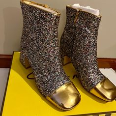 Stunning And Sparkly Free People (Circus Ny) All That Glitters Ankle Boots New With Tags, Box Included Each Boot Is Packed In It’s Own Dust Bag Size: 6.5 Approx. Heel Height: 2.25” True To Size Sold Out Online Color: Jewel Multi / Millenia Gold These Beautiful And Sparky Embellished Ankle Boots Are Made For Making A Statement And Standing Out! Featuring A Shiny Gold Cap Toe And Bold Block Heel With Sparkly Glitter Detail All Over. Fit: Ankle Height, Pull-On Style With Side Zipper Closure Feature Glamorous Holiday Boots With Round Toe, Glamorous Round Toe Boots For Holidays, Shimmer Round Toe Boots For Party, Party Boots With Shimmer And Round Toe, Multicolor Round Toe Heels For Winter, Glitter Ankle-high Party Boots, Party Glitter Ankle-high Boots, Glamorous Shimmer Boots With Round Toe, Glamorous Glitter Boots With Round Toe