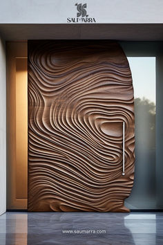 a wooden door with an artistic design on the front and side of it in a building