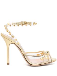 Teddy Bear-stud sandals from MOSCHINO featuring gold-tone, calf leather, transparent design, signature Teddy Bear motif, gold-tone stud detailing, buckle-fastening ankle strap, high-shine detailing, branded leather insole, open toe and 110mm stiletto heel. Moschino Teddy Bear, Tone Calves, Sandals Gold, Studded Sandals, Transparent Design, Stiletto Heel, Moschino, Calf Leather, Stiletto Heels