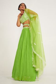 Parrot green lehenga with floral embroidered waistband including attached cancan. Comes with embroidered padded blouse, belt and dupatta.
Components: 4
Pattern: Embroidery
Type Of Work: Floral
Neckline: Sweetheart
Sleeve Type: Sleeveless
Fabric: Silk, Viscose, Organza, Lining: Butter Crepe
Color: Green
Other Details: 
Fitted at bust and waist
Lehenga Length: 44 inches
Closure: Side zip
Occasion: Destination Wedding - Aza Fashions Green Georgette Lehenga With Cutdana, Green Georgette Lehenga With Cutdana Details, Green Georgette Lehenga With Traditional Drape, Green Choli For Reception With Traditional Drape, Green Embroidered Georgette Lehenga, Green Choli With Cutdana For Reception, Green Lehenga With Cutdana For Reception, Green Georgette Lehenga For Navratri, Embroidered Green Georgette Choli