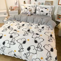 a bed with peanuts and stars on it