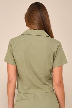 Impressing all day long is easy in the Lulus Complete Vibe Olive Green Cotton Button-Up Short Sleeve Top! Lightweight, linen-like woven cotton shapes this chic shirt that has a collared neckline, short sleeves, and a functional button placket at the front. Darted bodice ends at a slightly cropped hem. Pair with the matching pants for a complete look! Fit: This garment fits true to size. Length: Size medium measures 20" from shoulder to hem. Bust: Great for any cup size. Waist: Loosely Fitted. Un Chic Linen Top With Spread Collar, Chic Linen Top With Placket, Collared Khaki Top For Office, Collared Khaki Tops For Day Out, Khaki Linen Collared Shirt, Khaki Collared Top For Office, Khaki Collared Top For Day Out, Spring Linen Top With Collared Neckline, Collared Linen Tops For Daywear