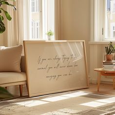 a living room with a couch, coffee table and large framed art piece on the wall