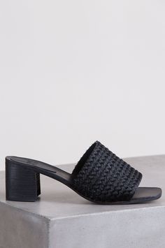 The intricately braided upper of hair-on calfskin leather gives this sandal a gentle texture and a rich look for everyday wear. These handmade slides cradle your feet in smooth, premium leather above and below, finished with a leather outsole and a sophisticated heel capped with a non-slip finish. Stacked wooden heel. Black Braided Sandals For The Beach, Black Braided Open Toe Sandals, Summer Open Toe Mules With Intrecciato Weave, Chic Braided Open Toe Heels, Woven Leather Block Heel Sandals For Vacation, Leather Block Heels With Braided Straps, Woven Leather Sandals With Block Heel, Leather Sandals With Woven Detail And Block Heel, Leather Heels With Woven Sole For Vacation