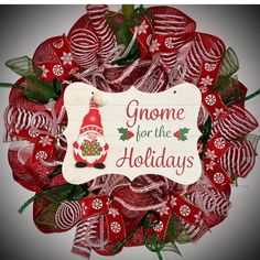 a christmas wreath with gnomes on it and the words gnome for the holidays written in white