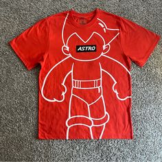 Southpole Astro Boy Graphic T-Shirt Men’s Short Sleeves Size Large Orange New Casual Crew Neck T-shirt With Cartoon Print, Casual Crew Neck T-shirt With Character Print, Casual Cartoon Print Shirt For Streetwear, Sporty Character Print Tops For Streetwear, Urban Cartoon Print Tops For Summer, Urban Tops With Cartoon Print For Summer, Urban Summer Tops With Cartoon Print, Red Crew Neck T-shirt With Character Print, Cartoon Print Short Sleeve Tops For Streetwear