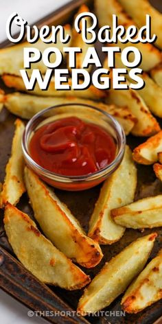 oven baked potato wedges with ketchup on top and the title overlay reads oven baked potato wedges